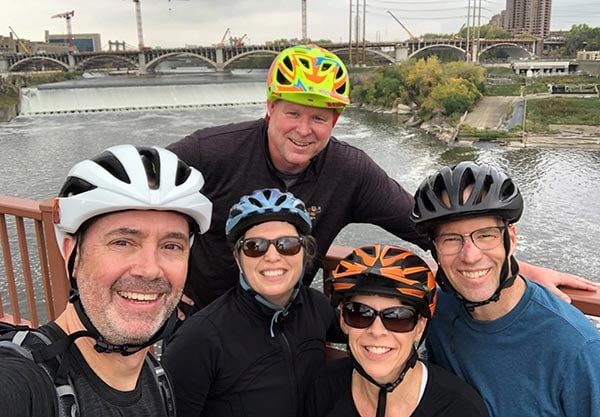 Group selfie of attorney Rob Roe and friends on a bicycle ride